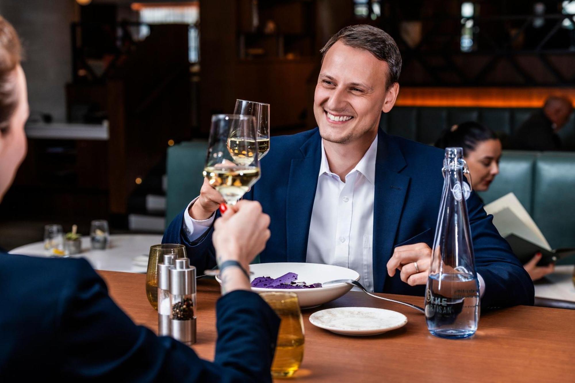 Prague Marriott Hotel Exterior photo A man drinking wine